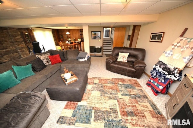 carpeted living room with stairs