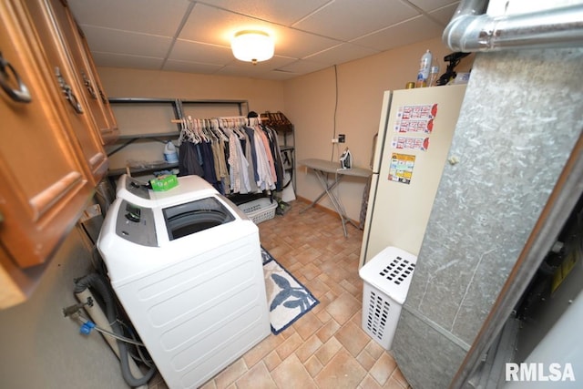 clothes washing area with washer and clothes dryer and laundry area