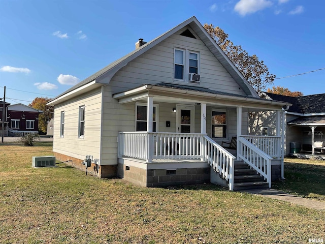 601 N Mcleansboro St, Benton, IL 62812 - bungalow-style home featuring a chimney, crawl space, cooling unit, a front yard, and covered porch