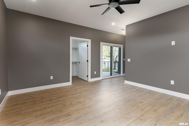 unfurnished room with recessed lighting, light wood finished floors, baseboards, and ceiling fan