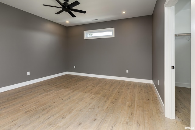 unfurnished room featuring visible vents, baseboards, ceiling fan, recessed lighting, and wood finished floors