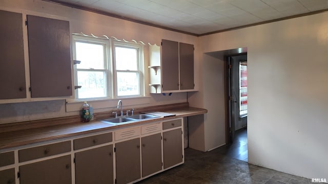 205 Shaw St, Harrisburg, IL 62946 - kitchen featuring crown molding and a sink