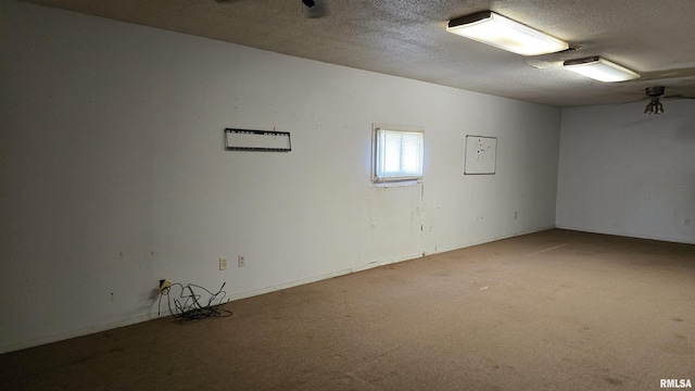 205 Shaw St, Harrisburg, IL 62946 - spare room featuring a textured ceiling and carpet flooring
