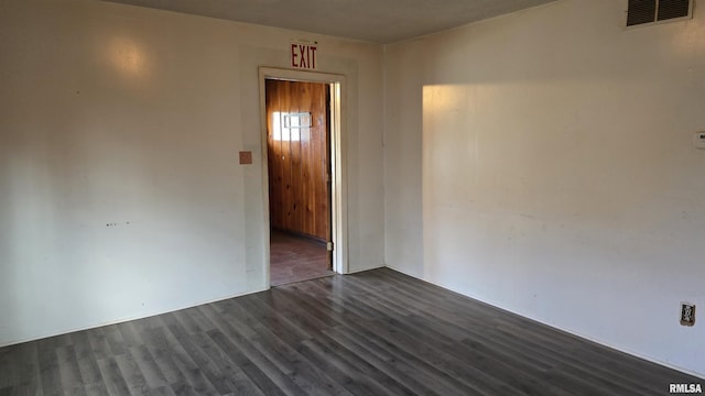 205 Shaw St, Harrisburg, IL 62946 - empty room featuring visible vents and dark wood-style floors