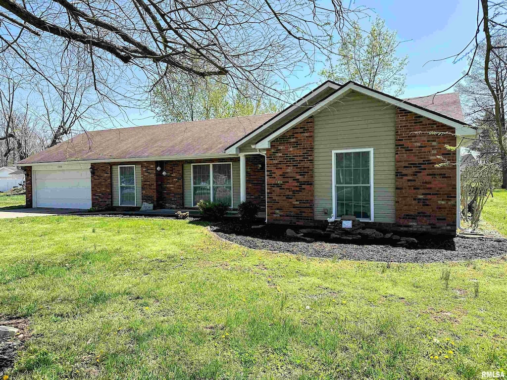 ranch-style home with concrete driveway, an attached garage, brick siding, and a front lawn