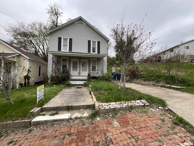 1012 W 9th St, Alton, IL 62002 - view of front of house with a front lawn and covered porch