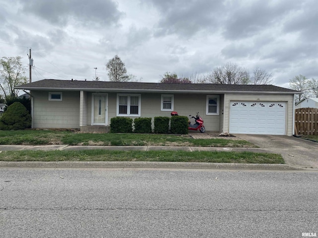 single story home featuring a garage, fence, and concrete driveway