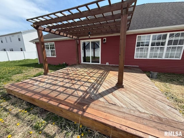 wooden deck with fence, a lawn, and a pergola