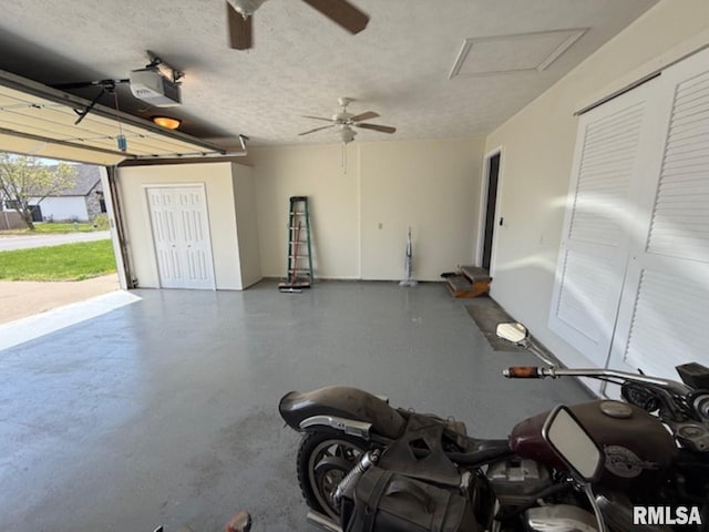 garage with a ceiling fan and a garage door opener