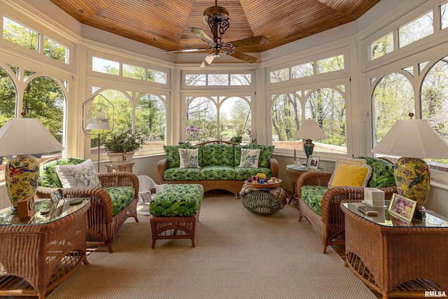 sunroom featuring a wealth of natural light, carpet, and wooden ceiling
