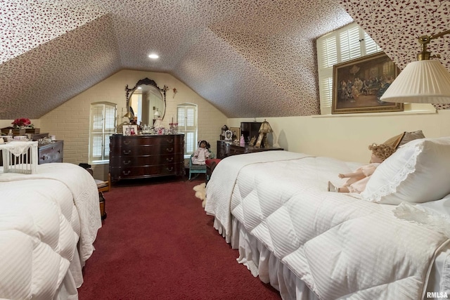 carpeted bedroom with vaulted ceiling