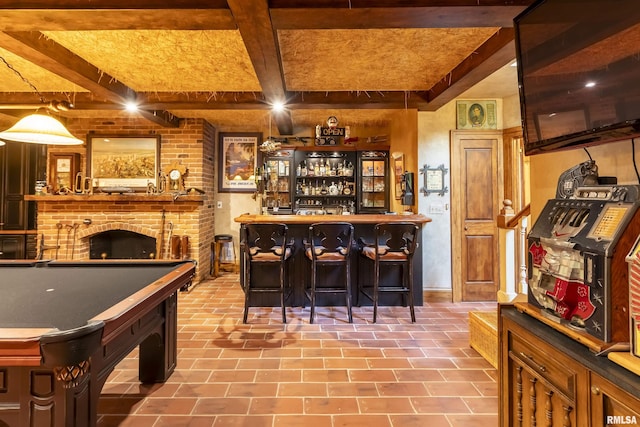 bar featuring a dry bar, a brick fireplace, baseboards, billiards, and beam ceiling