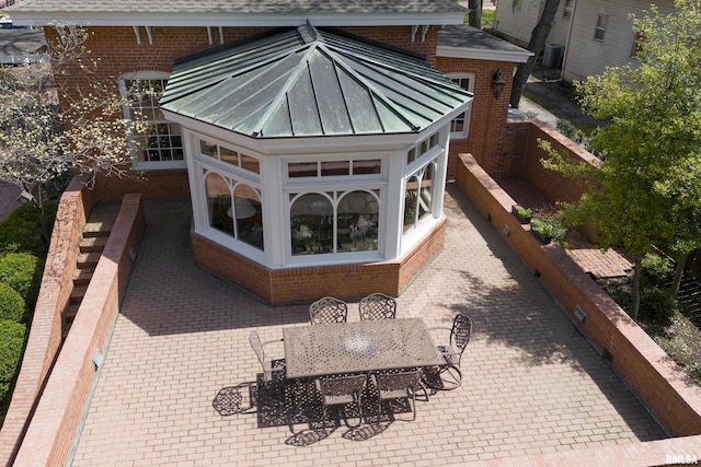 view of patio / terrace featuring fence and outdoor dining area