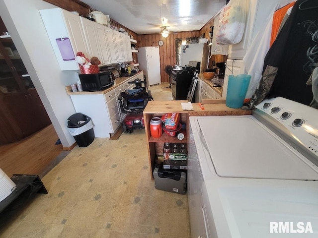 laundry area with washer / dryer and light floors