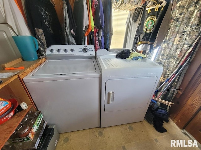 laundry area with washer and clothes dryer and laundry area