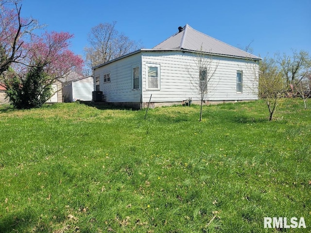 view of property exterior featuring a yard and cooling unit