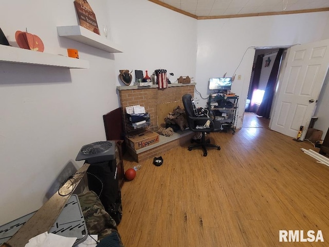 office space featuring crown molding and wood finished floors