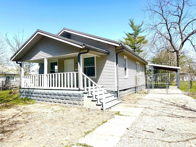 641 N Hickory St, Centralia, IL 62801 - view of front of property featuring a gate, fence, a porch, and driveway