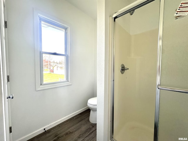 641 N Hickory St, Centralia, IL 62801 - full bathroom featuring a shower stall, wood finished floors, toilet, and baseboards
