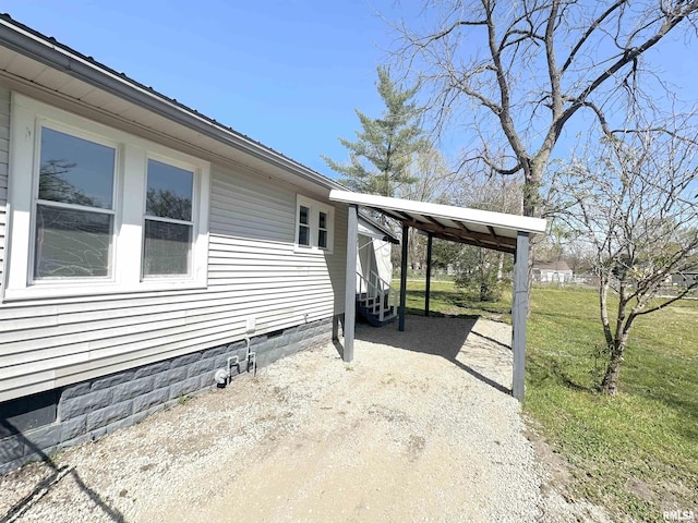 641 N Hickory St, Centralia, IL 62801 - view of home's exterior with a yard, dirt driveway, and a carport