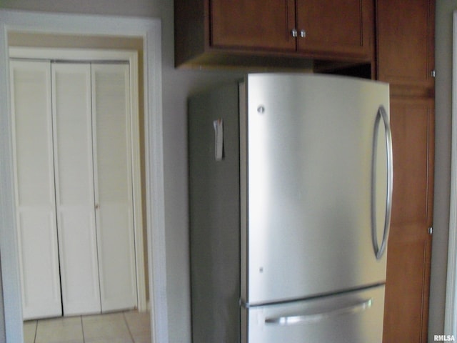 1003 S Johnson Ave, Carbondale, IL 62901 - kitchen with freestanding refrigerator and light tile patterned floors