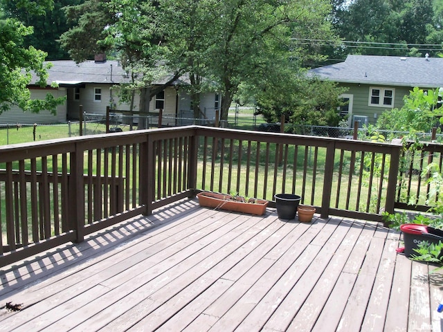 1003 S Johnson Ave, Carbondale, IL 62901 - wooden deck featuring a fenced backyard and a yard