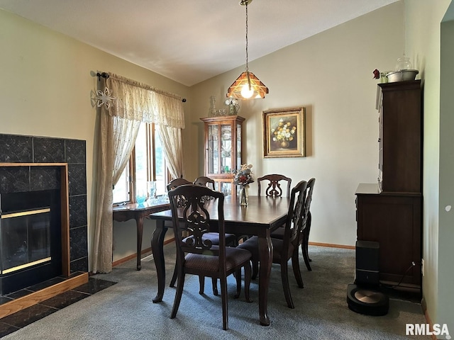 3 Suburban Dr, Murphysboro, IL 62966 - dining area featuring baseboards, lofted ceiling, carpet flooring, and a tile fireplace