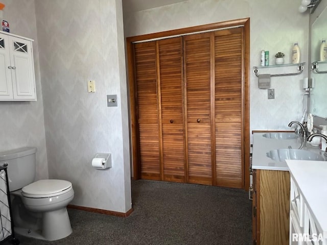 3 Suburban Dr, Murphysboro, IL 62966 - bathroom featuring baseboards, toilet, and vanity