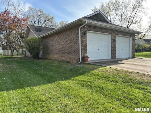 3 Suburban Dr, Murphysboro, IL 62966 - view of property exterior featuring brick siding, a yard, an attached garage, and concrete driveway