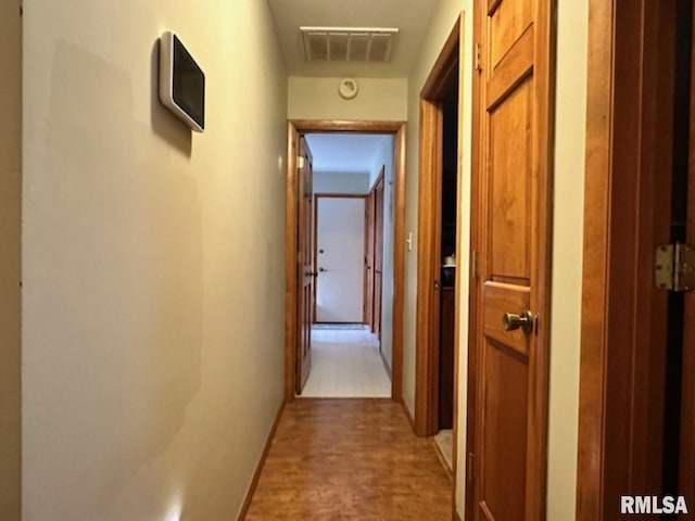 3 Suburban Dr, Murphysboro, IL 62966 - corridor with baseboards, wood finished floors, and visible vents