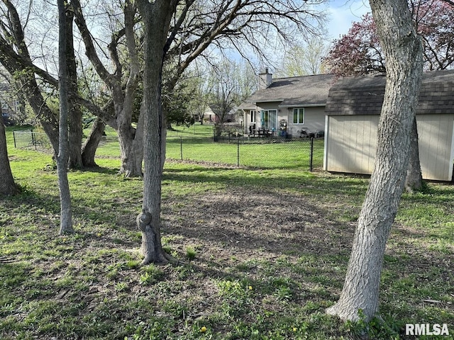3 Suburban Dr, Murphysboro, IL 62966 - view of yard featuring a storage unit, an outbuilding, and fence