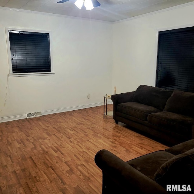 205 Texas St, Carterville, IL 62918 - living room with ceiling fan, ornamental molding, wood finished floors, and visible vents