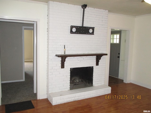 205 Texas St, Carterville, IL 62918 - details with wood finished floors, a brick fireplace, crown molding, and baseboards
