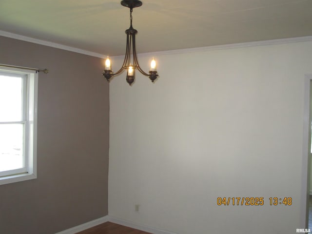 205 Texas St, Carterville, IL 62918 - empty room with a chandelier, a healthy amount of sunlight, dark wood-type flooring, and ornamental molding