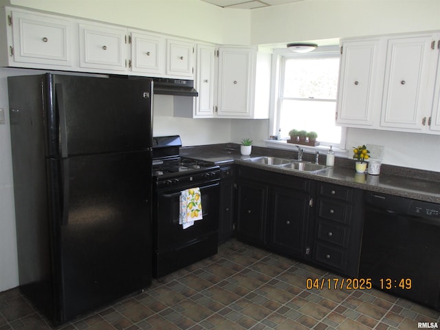 205 Texas St, Carterville, IL 62918 - kitchen with dark countertops, a sink, white cabinetry, and black appliances