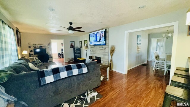 809 N 12th St, Herrin, IL 62948 - living area featuring ceiling fan, baseboards, wood finished floors, and a fireplace