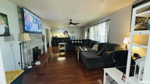 809 N 12th St, Herrin, IL 62948 - living area with ceiling fan, a stone fireplace, and wood finished floors