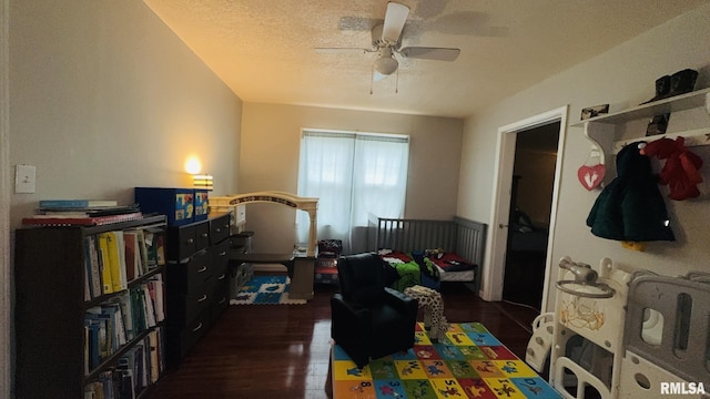 809 N 12th St, Herrin, IL 62948 - bedroom featuring wood finished floors, a textured ceiling, and a ceiling fan