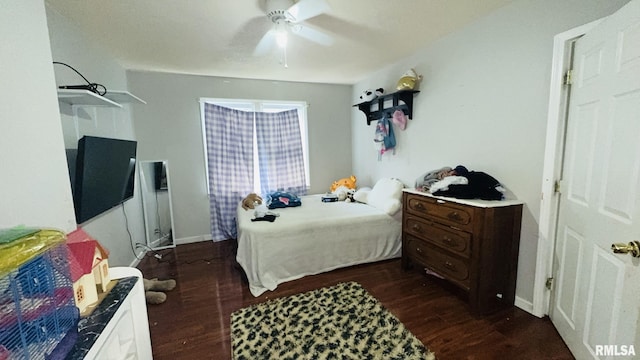 809 N 12th St, Herrin, IL 62948 - bedroom with baseboards, a ceiling fan, and dark wood-type flooring