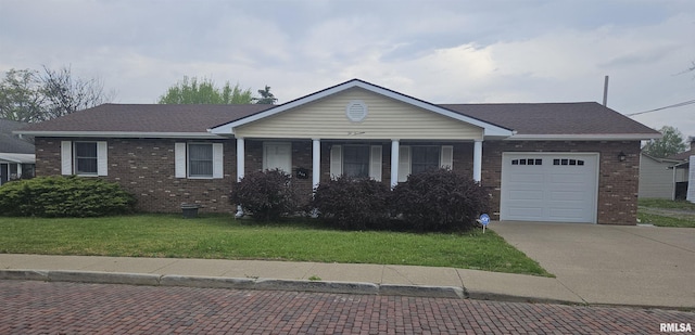 214 W Locust St, Harrisburg, IL 62946 - ranch-style home featuring a garage, concrete driveway, a shingled roof, a front yard, and brick siding