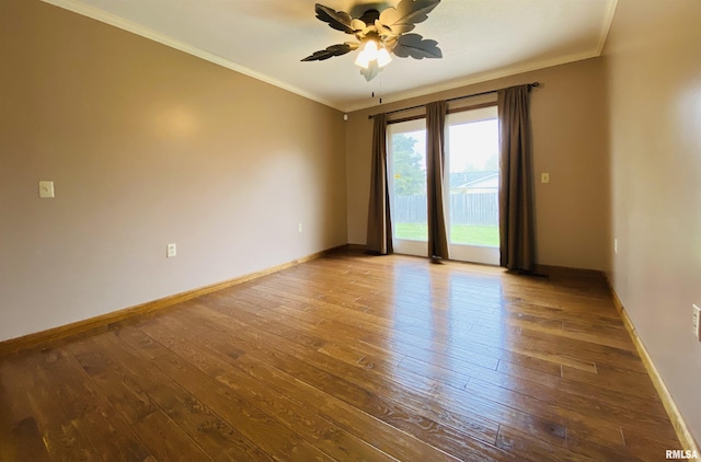 214 W Locust St, Harrisburg, IL 62946 - empty room featuring wood-type flooring, crown molding, baseboards, and a ceiling fan
