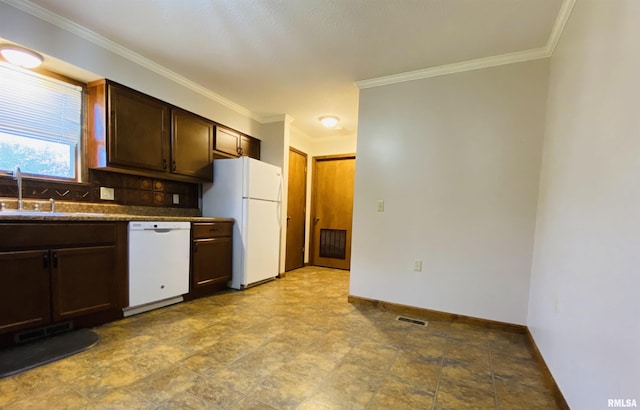 214 W Locust St, Harrisburg, IL 62946 - kitchen featuring dark brown cabinets, dark countertops, visible vents, baseboards, and white appliances