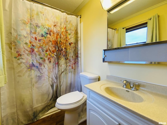 214 W Locust St, Harrisburg, IL 62946 - full bath featuring toilet, wood finished floors, vanity, and crown molding