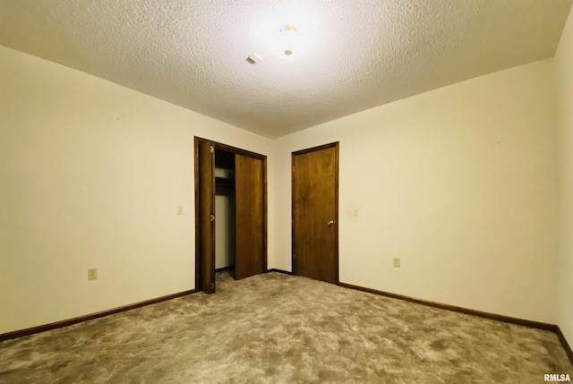 214 W Locust St, Harrisburg, IL 62946 - empty room with carpet floors, a textured ceiling, and baseboards