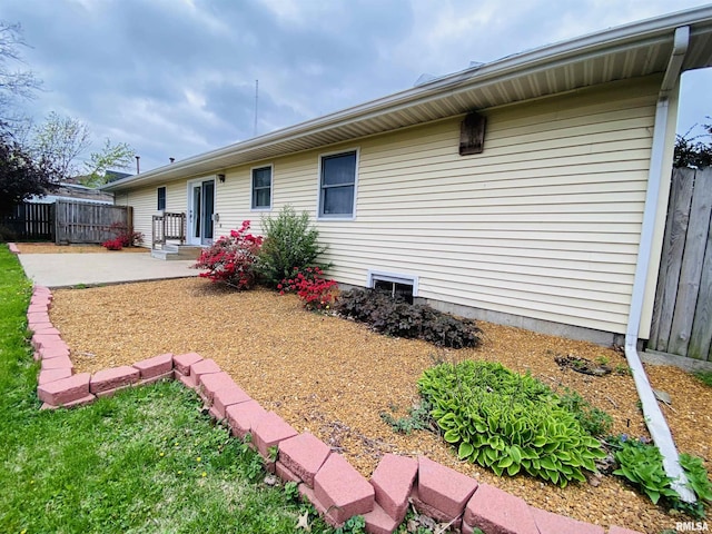 214 W Locust St, Harrisburg, IL 62946 - rear view of property featuring fence and a patio area