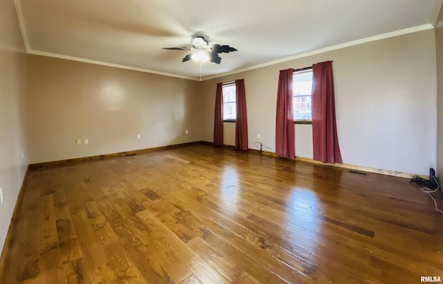 214 W Locust St, Harrisburg, IL 62946 - spare room with hardwood / wood-style flooring, baseboards, a ceiling fan, and crown molding