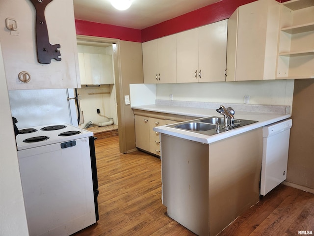 kitchen featuring a sink, light wood-style floors, white appliances, open shelves, and light countertops