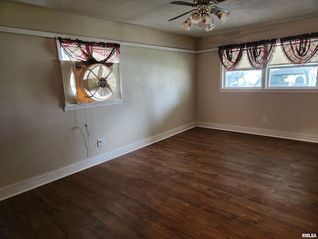 unfurnished dining area featuring baseboards, a textured ceiling, ceiling fan, and dark wood-style flooring