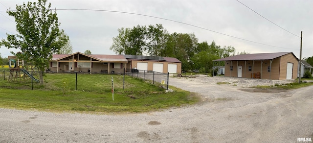 15 Lincoln St, Stonefort, IL 62987 - view of front of house with fence private yard, a front lawn, and metal roof