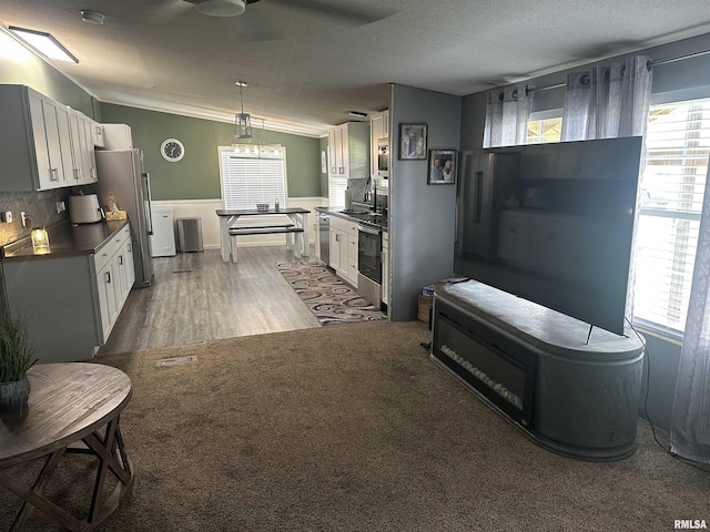 15 Lincoln St, Stonefort, IL 62987 - kitchen with stainless steel appliances, dark wood-style floors, a sink, dark countertops, and backsplash